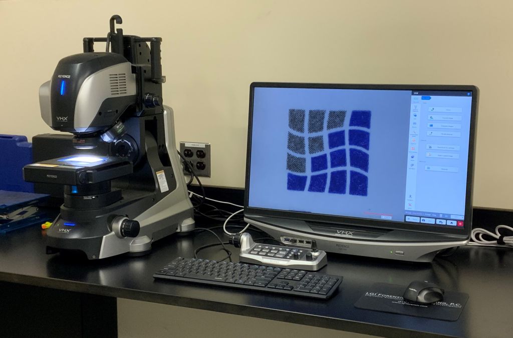 A closeup of LGI's laboratory microscope and monitor in the Virtual Examination area of the building.